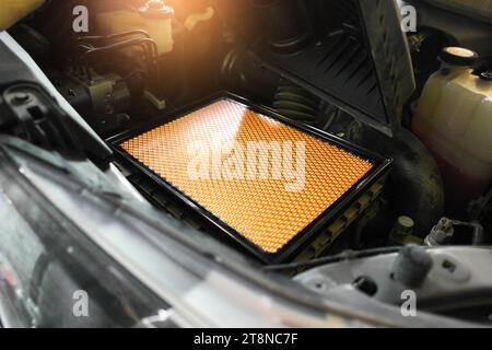 New car air filter on a filter compartment of air duct in car engine compartment , Car spare parts concept Stock Photo