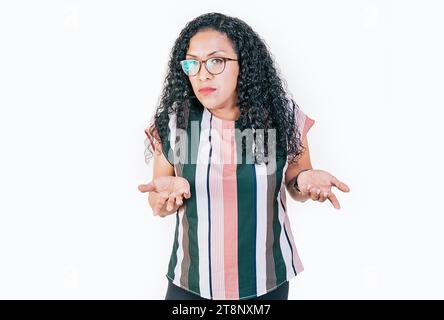 Puzzled afro woman gesturing with hand isolated. Girl in glasses with puzzled face frowning. Puzzled people making hand gestures Stock Photo