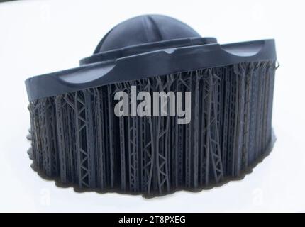 Black abstract object printed on 3D printer from photopolymer isolated on white background. SLA. Model 3D printed from liquid resins. Progressive additive 3D printer printing technology. Sla-printing. Stock Photo