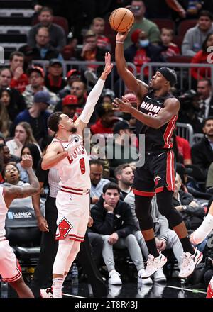 Chicago, USA. 20th Nov, 2023. Jimmy Butler (R) of Miami Heat shoots over Zach LaVine of Chicago Bulls during the 2023-2024 NBA regular season match between the Miami Heat and the Chicago Bulls at United Center in Chicago, the United States, on Nov. 20, 2023. Credit: Joel Lerner/Xinhua/Alamy Live News Stock Photo