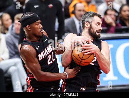 Chicago, USA. 20th Nov, 2023. Kevin Love (R) and Jimmy Butler of Miami Heat fight for a rebound during the 2023-2024 NBA regular season match between the Miami Heat and the Chicago Bulls at United Center in Chicago, the United States, on Nov. 20, 2023. Credit: Joel Lerner/Xinhua/Alamy Live News Stock Photo