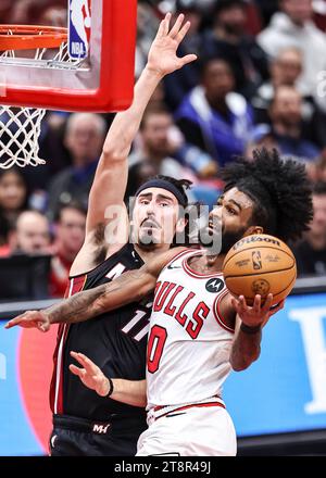 Chicago, USA. 20th Nov, 2023. Coby White (R) of Chicago Bulls drives to the basket during the 2023-2024 NBA regular season match between the Miami Heat and the Chicago Bulls at United Center in Chicago, the United States, on Nov. 20, 2023. Credit: Joel Lerner/Xinhua/Alamy Live News Stock Photo