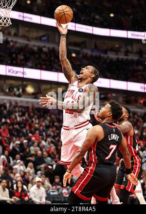 Chicago, USA. 20th Nov, 2023. DeMar DeRozan (top) of Chicago Bulls goes for a lay-up during the 2023-2024 NBA regular season match between the Miami Heat and the Chicago Bulls at United Center in Chicago, the United States, on Nov. 20, 2023. Credit: Joel Lerner/Xinhua/Alamy Live News Stock Photo