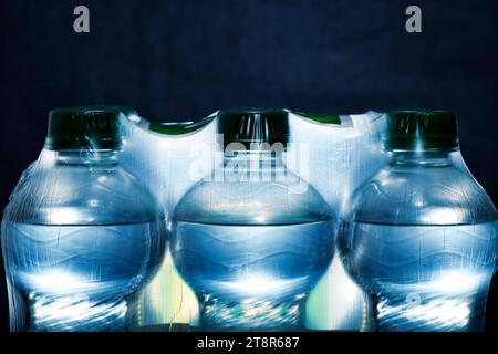 Detail of plastic bottles with water in packaging Stock Photo