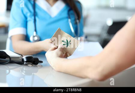 Female doctor writes prescription for medical marijuana Stock Photo