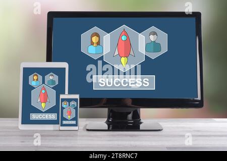 Business success concept shown on different information technology devices Stock Photo