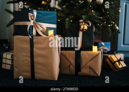Many beautiful gift boxes under Christmas tree. Merry Christmas. Santa. Christmas decorations. Christmas tree. Gift boxes and more. Stock Photo