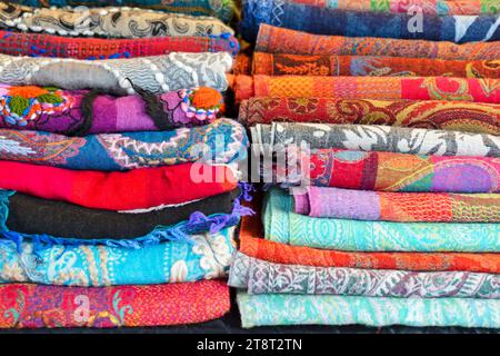 Folded fabrics textiles with patterns on the market Stock Photo