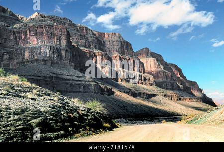 Down the Grand Canyon, The Grand Canyon, is a steep-sided canyon carved by the Colorado River in the United States in the state of Arizona. It is contained within and managed by Grand Canyon National Park, the Hualapai Tribal Nation, and the Havasupai Tribe Stock Photo