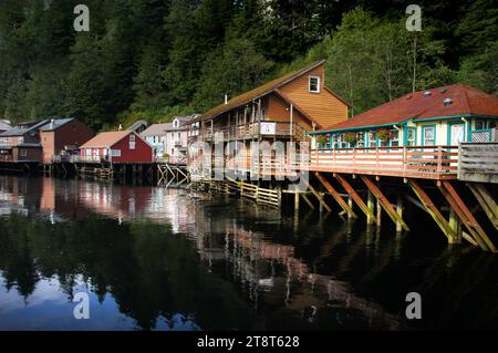 Creek Street. Ketchikan Alaska, Visited by thousands of visitors every year, historic Creek Street Ketchikan Alaska is one of the most popular things to see in Ketchikan. The antique boardwalk on wooden pilings over Ketchikan Creek is home to restaurants, unique curio shops, the Dollys House Museum & private dwellings, as well as some of the best salmon viewing areas in Ketchikan. Married Mans Trail and the Salmon Ladder are also not to be missed when exploring Creek Street Stock Photo