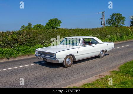1967 60s sixties American White Dodge Coupe Petrol 2500 cc. Dodge Charger; restored classic motors, automobile collectors,  motoring enthusiasts and historic veteran cars travelling in Cheshire, UK Stock Photo