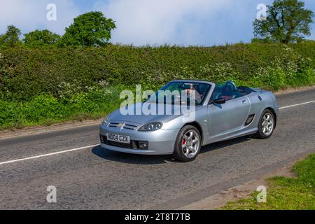 2004 Silver MG TF 135 Cool Blue open-topped roadster Roadster Petrol 1796 cc cabriolet; Vintage, restored British classic motors, automobile collectors,  motoring enthusiasts and historic veteran cars travelling in Cheshire, UK Stock Photo