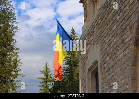 Romanian flag on  Cantacuzino Castle, Busteni, Romania Stock Photo