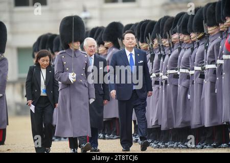 King Charles III and President of South Korea Yoon Suk Yeol during the ceremonial welcome at Horse Guards Parade, central London, on day one of the state visit to the UK. Picture date: Tuesday November 21, 2023. Stock Photo