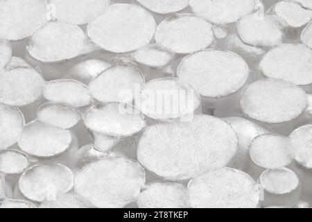 Expanded polystyrene foam porous material white cells circle, close-up macro representing foamed cellular plastic masses. Stock Photo