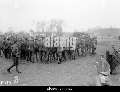 Soldiers playing the gambling game of Two-up, France, A circle of World War I New Zealand soldiers watch a game of Two-up at their camp in Louvencourt. Photograph taken 30 April 1918 Stock Photo