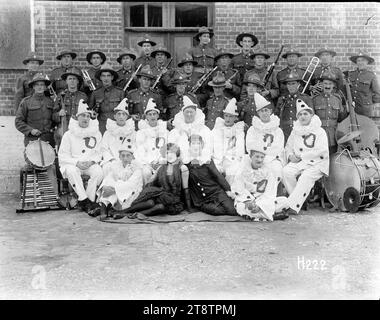 The Digger Pierrots and their orchestra, A group portrait of the Digger Pierrots, an entertainment group formed to entertain New Zealand troops during World War I, pictured with their orchestra. The Pierrot in the second row, four from left identified by a descendant as Dave Kenny. The Pierrot second left in the second row may be Theodore Tresize. Photograph taken 25 August 1917 Stock Photo