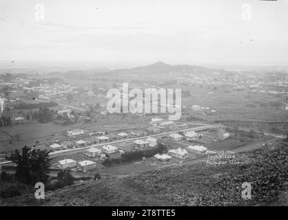 Epsom and One Tree Hill from Mount Eden, Auckland, New Zealand, Looking south-east over houses in Epsom and towards One Tree Hill from Mount Eden, Auckland, New Zealand. Manukau Harbour can be seen in the far distance in early 1900s Stock Photo