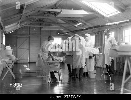 An operation being conducted in the theatre of the New Zealand Stationary Hospital, Wisques, France, An operation being conducted in the theatre of the New Zealand Stationary Hospital during World War I. Photograph taken Stock Photo