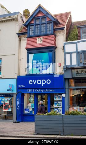 The Evapo shop in North Street Brighton specialising in CBD and Vaping  solutions with a sign above claiming vaping is 95 percent less harmful than  smoking Stock Photo