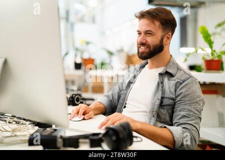 Male computer programmer working at office Stock Photo