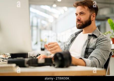 Male computer programmer working at office Stock Photo