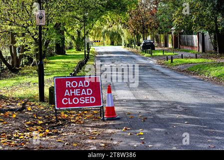 A large 'Road Ahead Closed' sign on a rural road at Ferry Lane  Laleham Surrey England UK Stock Photo