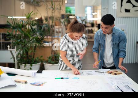Two architects working on blueprint Stock Photo