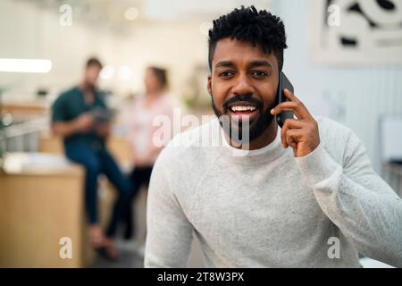 African American man talking on smart phone Stock Photo