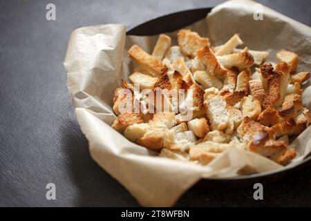 Crackers, dried baked pieces of white bread, selective focus. Stock Photo