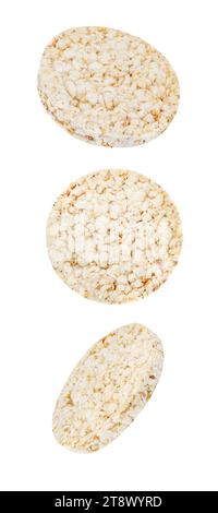 Puffed rice bread, rice cakes,  falling, hanging, flying, soaring, round diet crispbreads, isolated on white background with clipping path. Stock Photo
