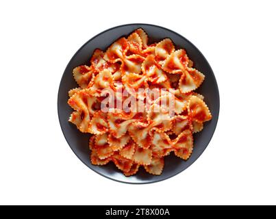 Farfalle, cooked pasta with tomato sauce, isolated on white background with clipping path, top view. Stock Photo
