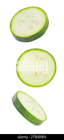 Zucchini, sliced round pieces, falling, hanging, flying, soaring, isolated on white background with clipping path. Stock Photo