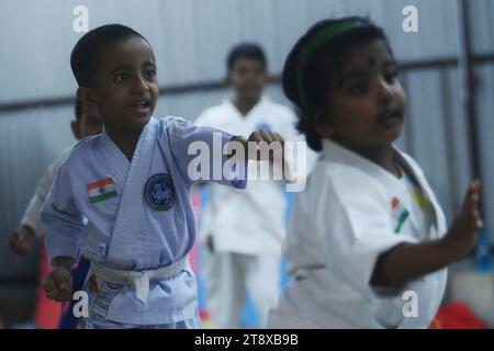 Children, who are students of the 'Shotokan Karate-Do Association of Tripura', are seen performing karate during a special class on Children's day in Barjala, at Agartala. Tripura, India. Stock Photo