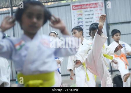 Children, who are students of the 'Shotokan Karate-Do Association of Tripura', are seen performing karate during a special class on Children's day in Barjala, at Agartala. Tripura, India. Stock Photo