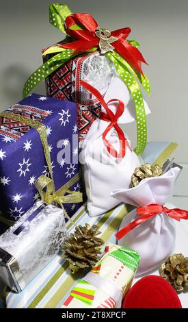 wrapping Christmas gift and presents for whole family Stock Photo - Alamy