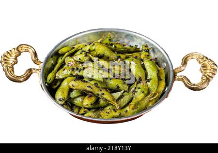 Roasted green Edamame Soy Beans with sea salt and sesame seeds in a skillet. Isolated, white background Stock Photo