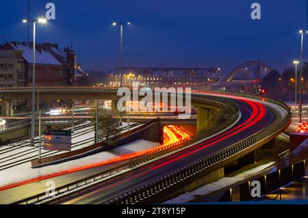 2022-12-09; evening road with smeared traces of cars Gdansk Poland Stock Photo