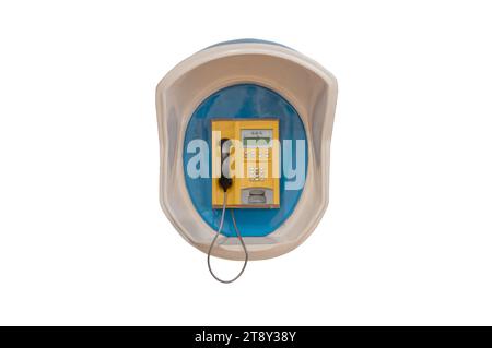 Wall mounted old public phone isolated on a white background Stock Photo