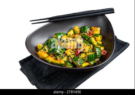 Chinese smashed cucumbers with herbs and sesame oil. Isolated, white background Stock Photo