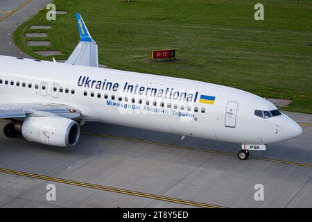 Close-up photo of Ukraine International Airlines Boeing 737-900 taxiing for takeoff from Lviv. Taken from ATC tower Stock Photo