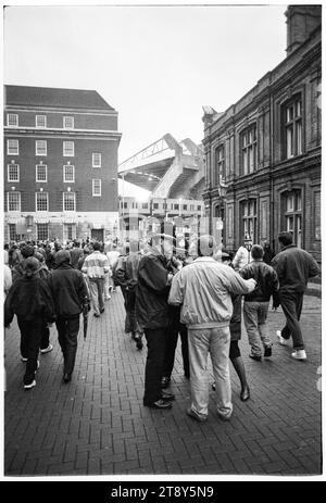 Fans head down Quay Street towards Westgate Street with the iconic concrete arms of the old stadium on the horizon. FIFA World Cup 1994 Group 4 Qualification – Wales v RCS (Czechoslovakia AKA Representation of Czechs and Slovaks) at Cardiff Arms Park, Wales, UK on 8 September 1993. A win for Wales in this game would almost guarantee qualification with 2 group matches remaining. They led 2-1 but conceded a late free kick goal from Peter Dubovský and the match ended 2-2. Photo: Rob Watkins Stock Photo