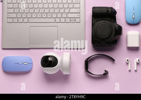 Modern gadgets on lilac background Stock Photo