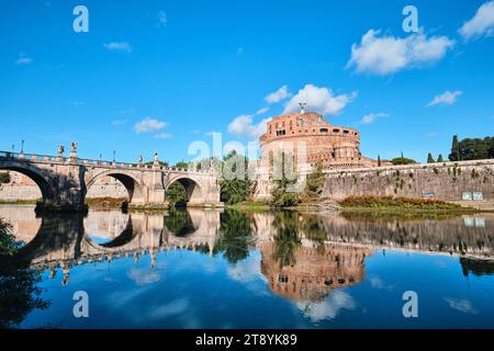 Rome, Italy - November 2 2023: Castel Sant Angelo and Ponte Sant Angelo reflection on Tiber River Stock Photo