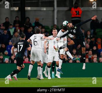 Aviva Stadium, Dublin, Ireland. 21st Nov, 2023. International Football Friendly, Republic of Ireland versus New Zealand; Andrew Omobamidele of Ireland challenges for the header Credit: Action Plus Sports/Alamy Live News Stock Photo