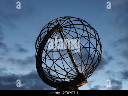 Nordkap, Norway. 24th Aug, 2023. The globe, photographed in the early morning on the North Cape's slate plateau, some 300 meters above the Arctic Ocean. The steel sculpture is a landmark of the North Cape and was erected in 1978. Credit: Soeren Stache/dpa/Alamy Live News Stock Photo