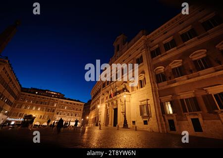 Rome, Italy - October 29 2023: Illuminated Palazzo Montecitorio (Chamber of Deputies of Italy) at dusk Stock Photo