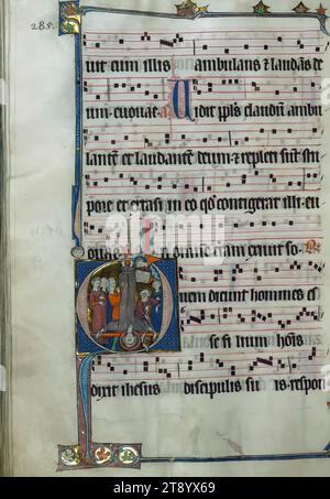 Beaupre Antiphonary, Vol. 1, Initial 'Q' with Crucifixion of St. Peter, Illuminated in Hainaut ca. 1280 and completed in 1290, this collection of richly illuminated Cistercian manuscripts is a rare example of those being produced in Flanders at the end of the thirteenth century. Eighteen extant large historiated initials, flourished and decorated initials, and an abundance of amusing drolleries facilitate a liturgical narrative within the text. However, additions and removals within the text and imagery tells much about the use and history of the manuscript Stock Photo