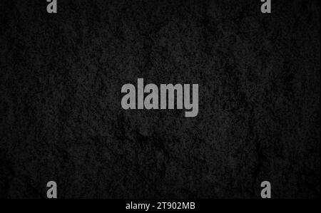 Close-up of dark gray, almost black, solid fine-grained granite rock surface texture, front view. Abstract natural textured background in black&white. Stock Photo