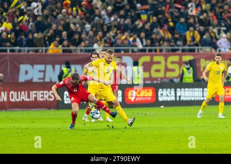 Bucharest, Romania. 22nd Nov, 2023.George Puscas of Romania and Nico Elvedi of Switzerland fighting for the ball during the UEFA Euro 2024, European Qualifiers, Group I football match between Romania and Switzerland on November 21, 2023 at Arena Nationala in Bucharest, Romania - Photo Mihnea Tatu/DPPI Credit: DPPI Media/Alamy Live News Stock Photo